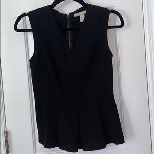 Black sleeveless peplum top